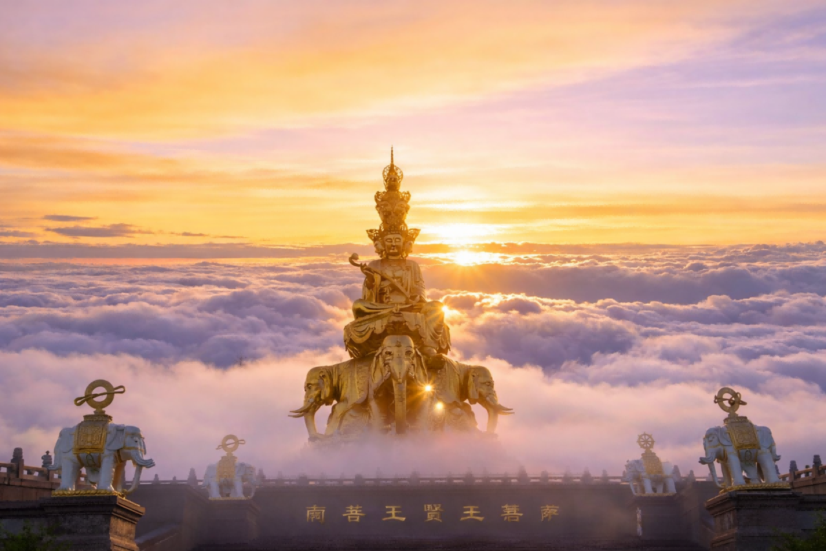 Golden Samantabhadra statue at Mount Emei rising above a sea of clouds at sunrise in Sichuan, China.