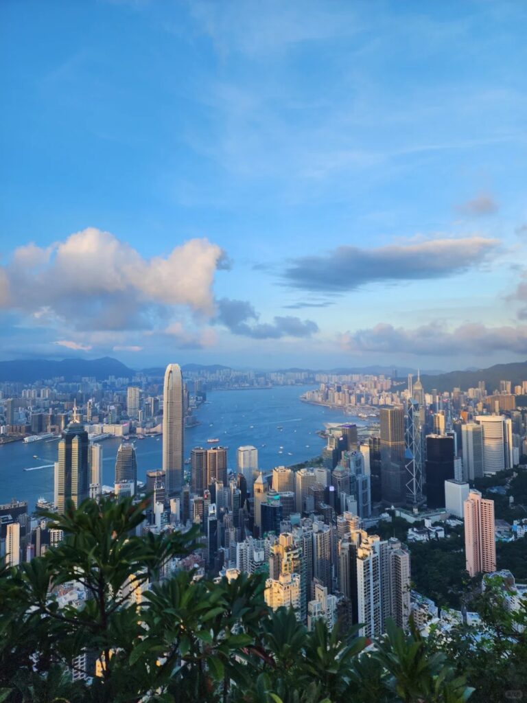 Sunset view of Victoria Harbour and Hong Kong skyline from Victoria Peak, capturing the city’s blend of nature and urban life