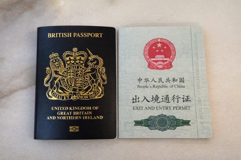 British passport and China exit-entry permit placed side by side.