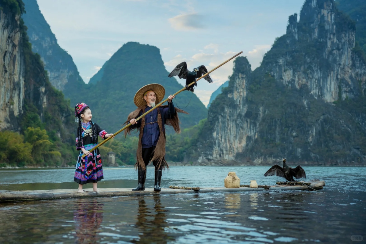 Fisherman with cormorants on a bamboo raft in Guilin Li River