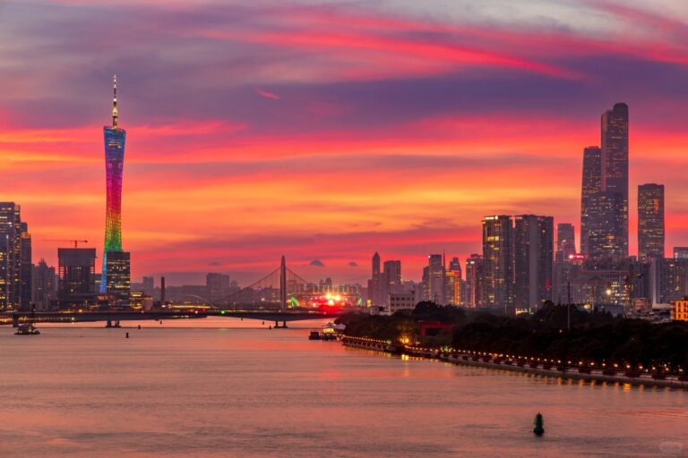 Colorful sunset over Guangzhou’s skyline, featuring Canton Tower and the Pearl River.