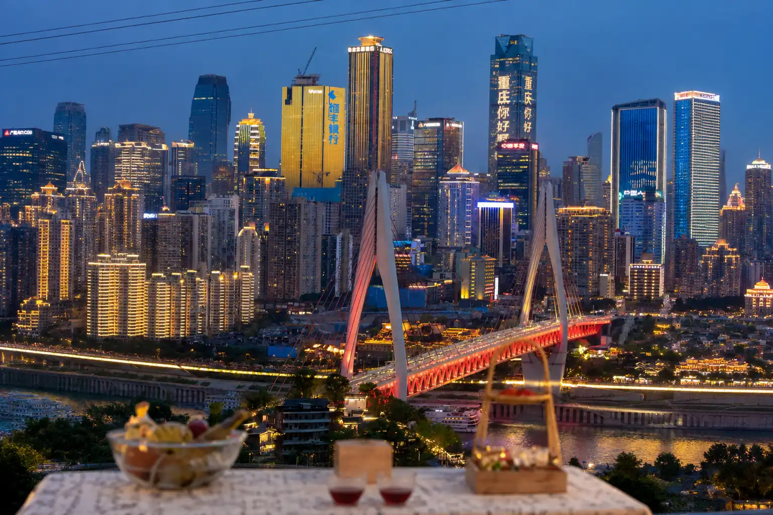 Chongqing skyline and bridge illuminated at night