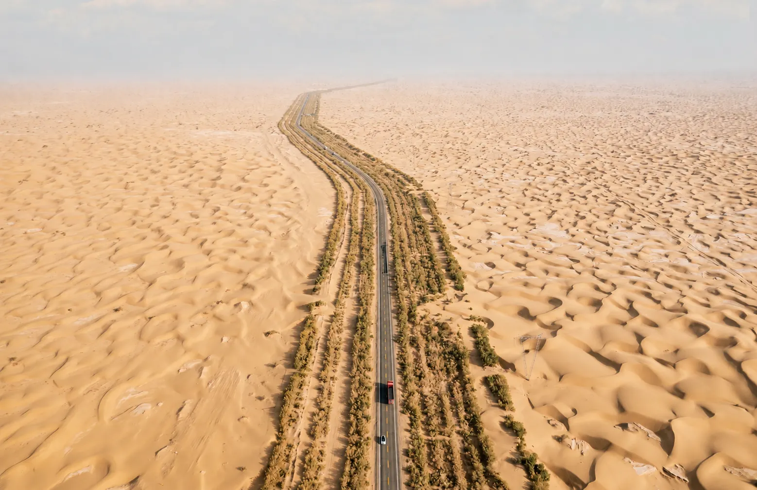 Desert highway crossing the Taklamakan Desert in Xinjiang
