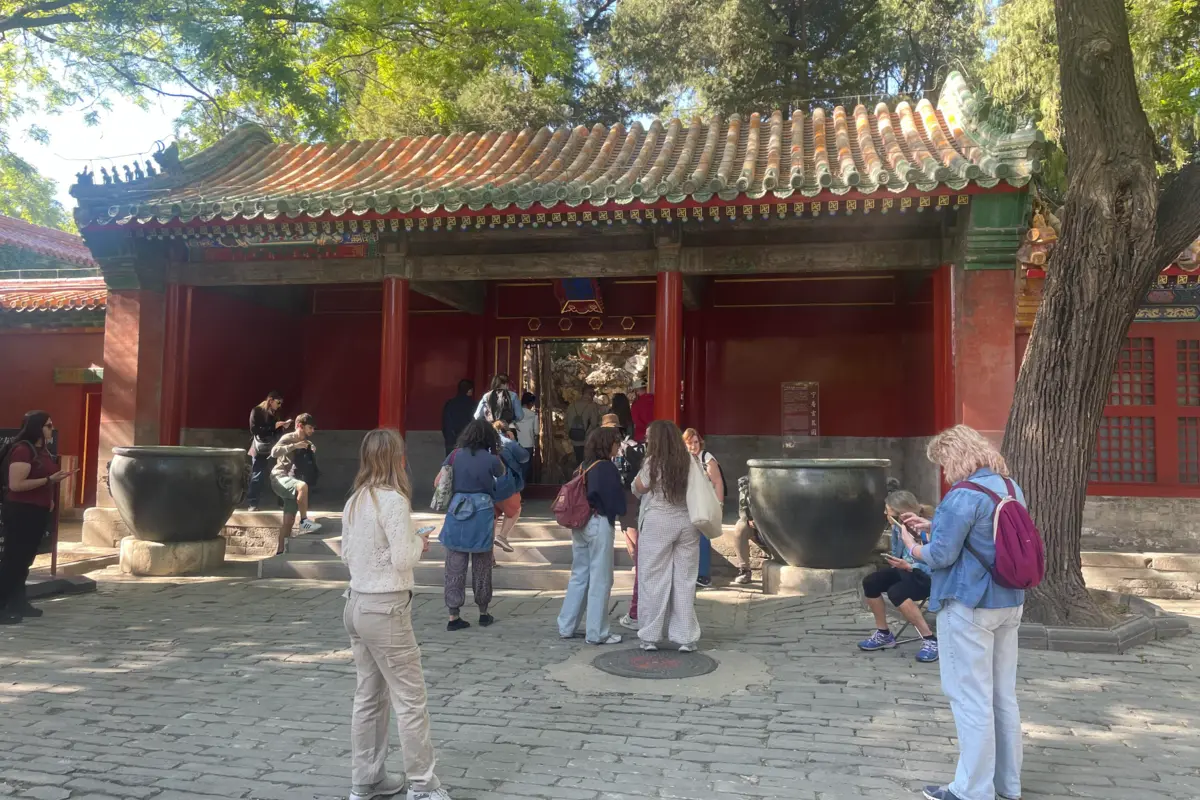 International visitors exploring traditional Chinese architecture during a China journey