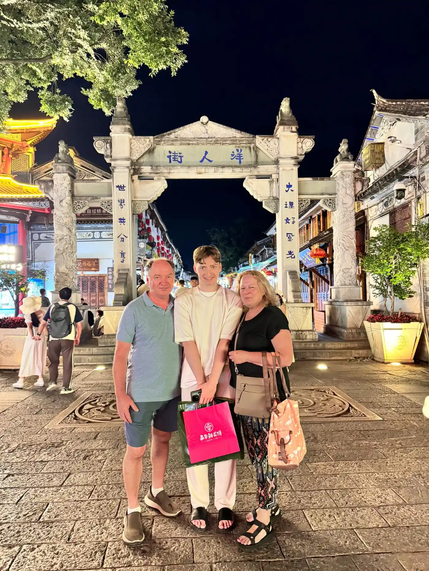 Travelers on Yangren Street in Dali Old Town at night