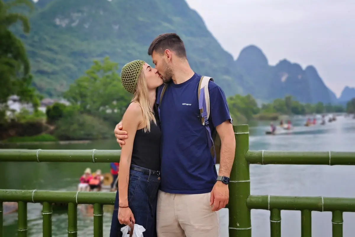 Couple enjoying the Li River and karst mountain scenery in Guilin, China