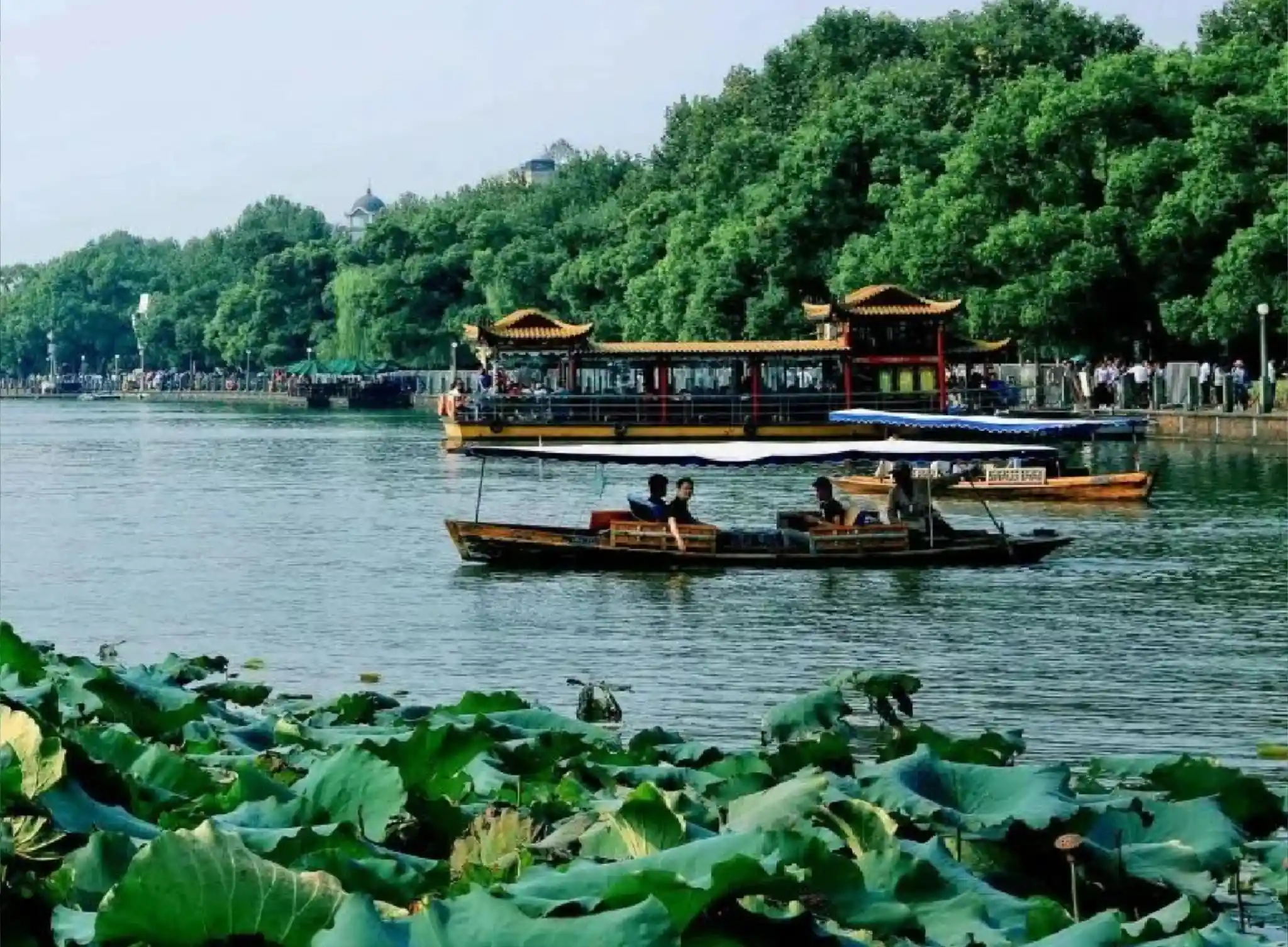 Boat ride and lakeside scenery on West Lake in Hangzhou