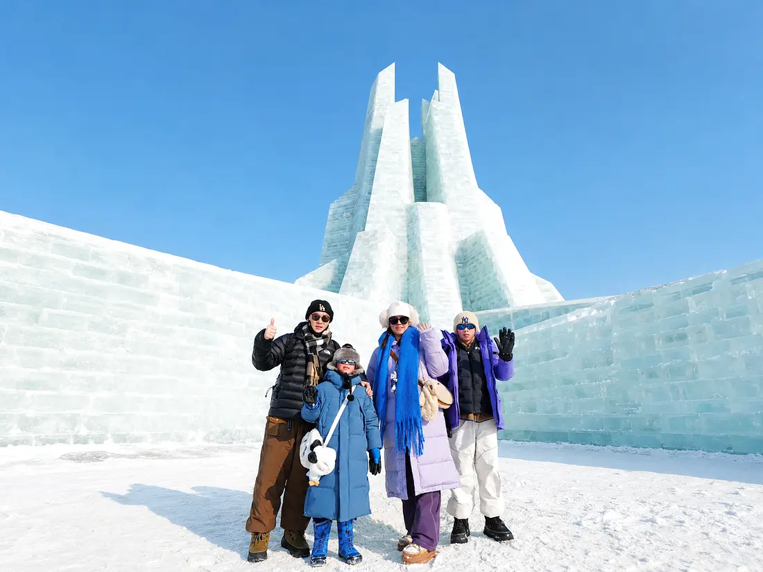 Family enjoying winter snow activities during a Harbin trip
