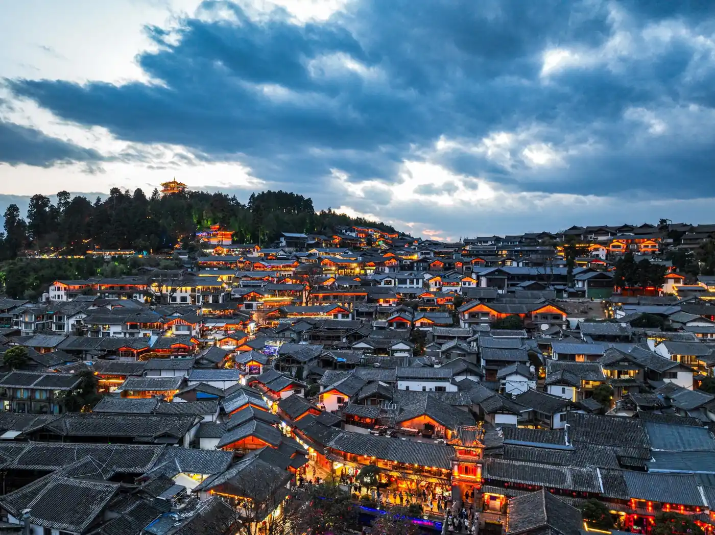Panoramic evening view over the rooftops of Lijiang Old Town in Yunnan