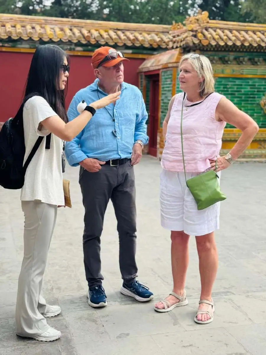 International travelers exploring a historic destination with a local guide in China