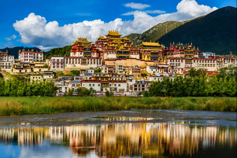 Songzanlin Monastery reflected in the wetlands of Shangri-La, Yunnan