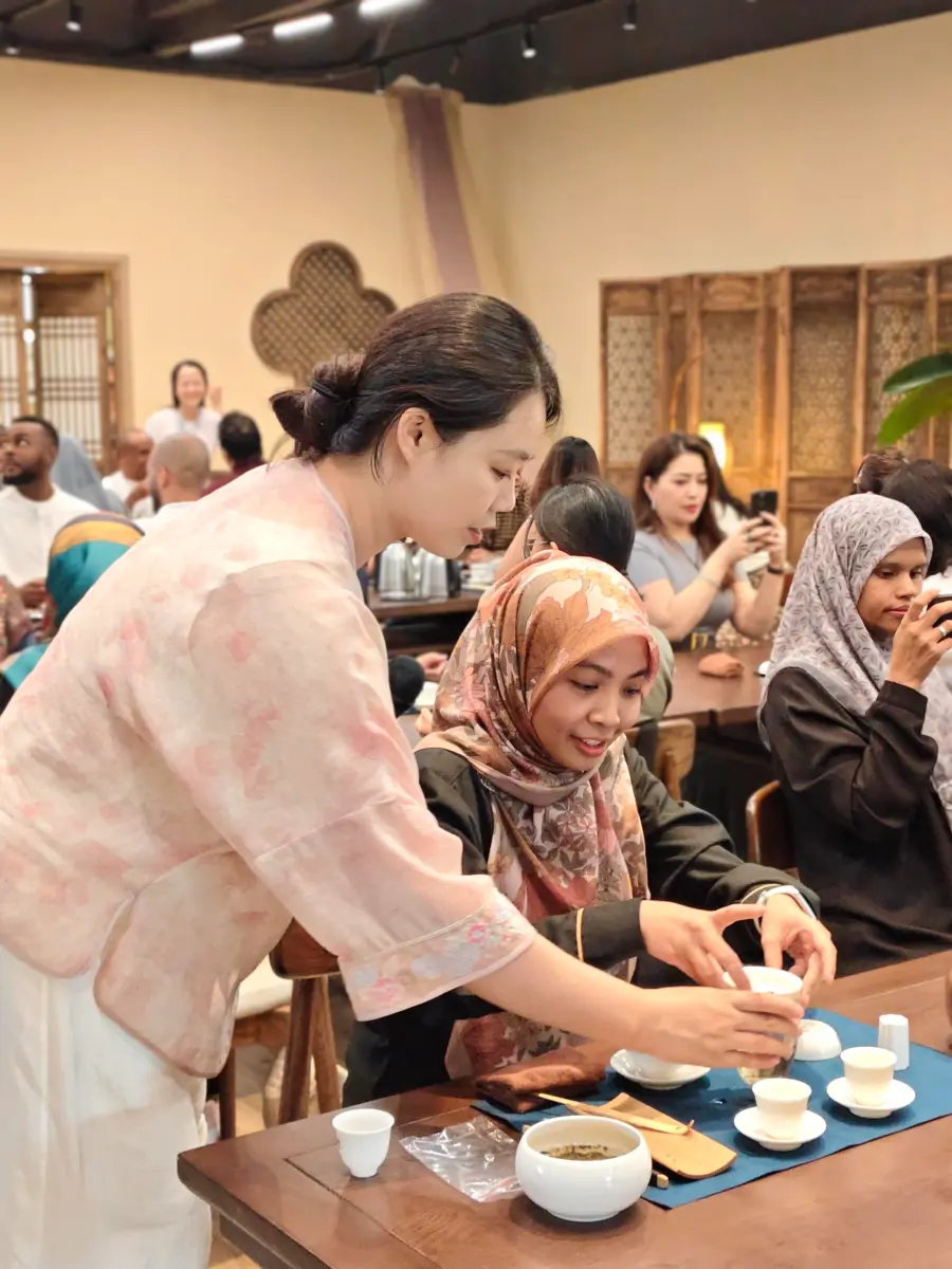 International visitors taking part in a traditional Chinese tea experience in China