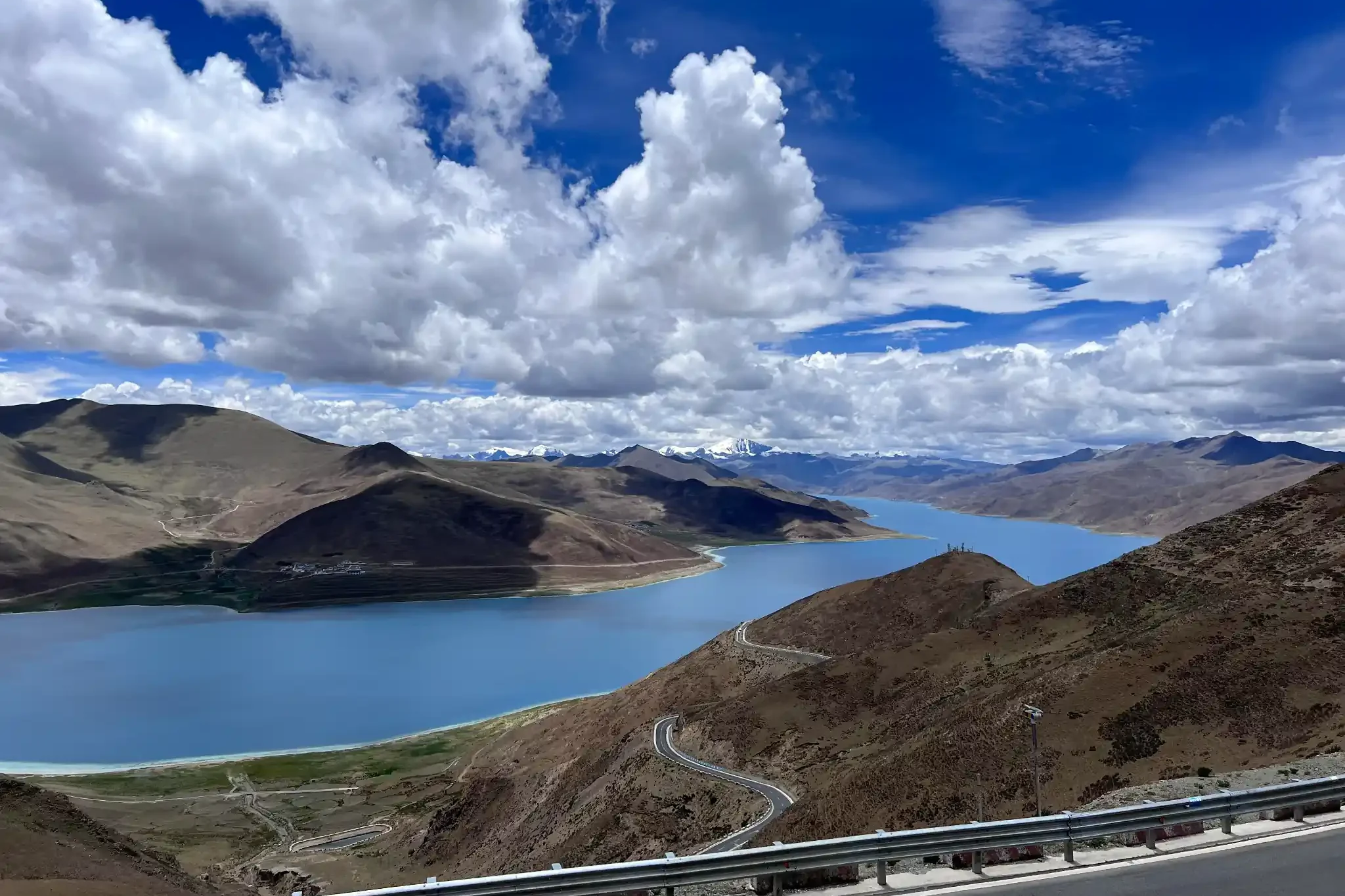 Turquoise Yamdrok Lake surrounded by mountains in Tibet