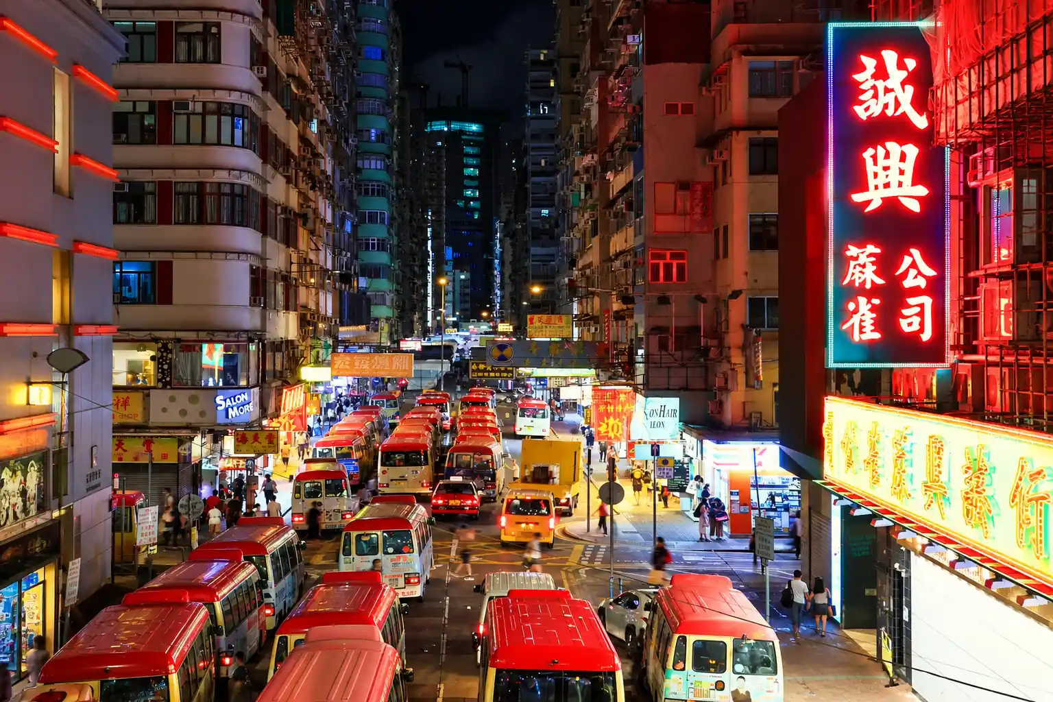 Neon-lit street in Kowloon, Hong Kong at night