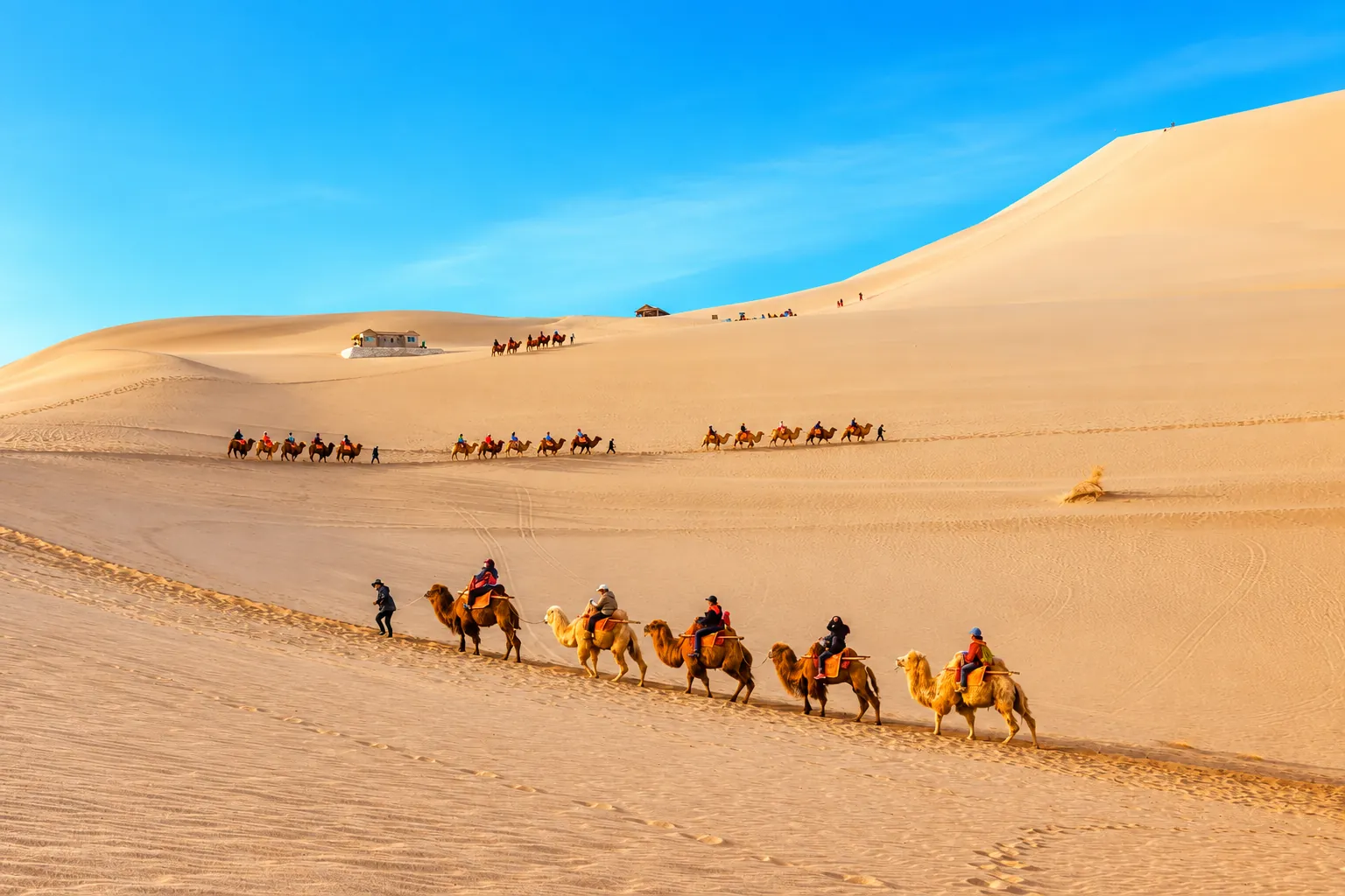 Mingsha Mountain and Crescent Spring in Dunhuang at sunset