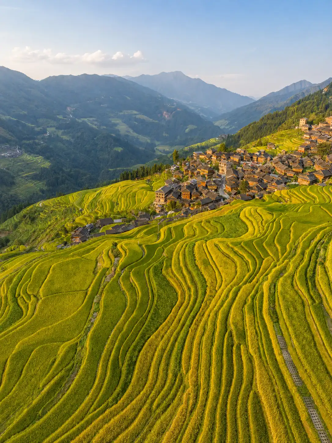 Golden terraced fields and mountain villages in Guizhou during autumn
