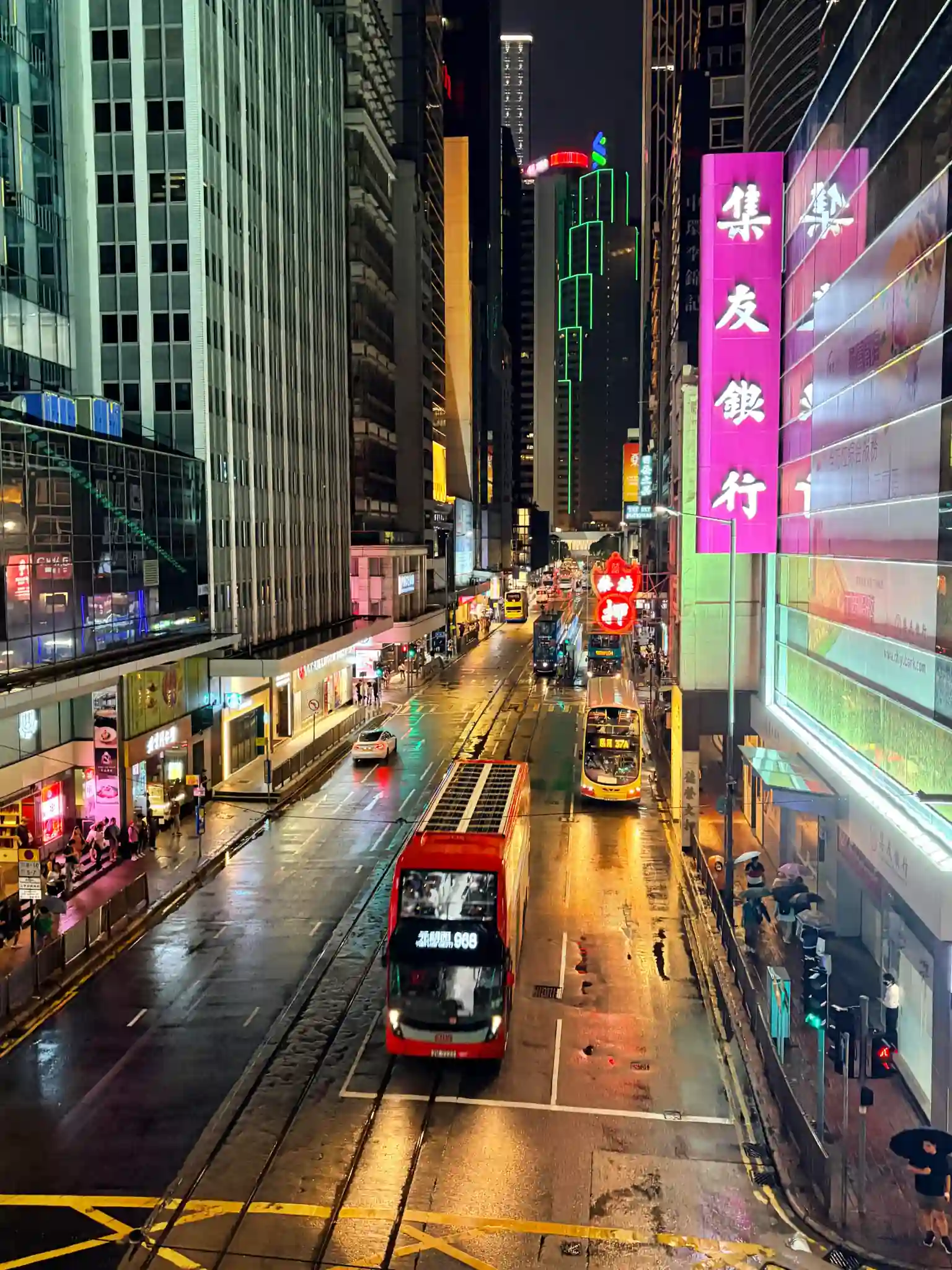 Hong Kong night street with double-decker buses in summer