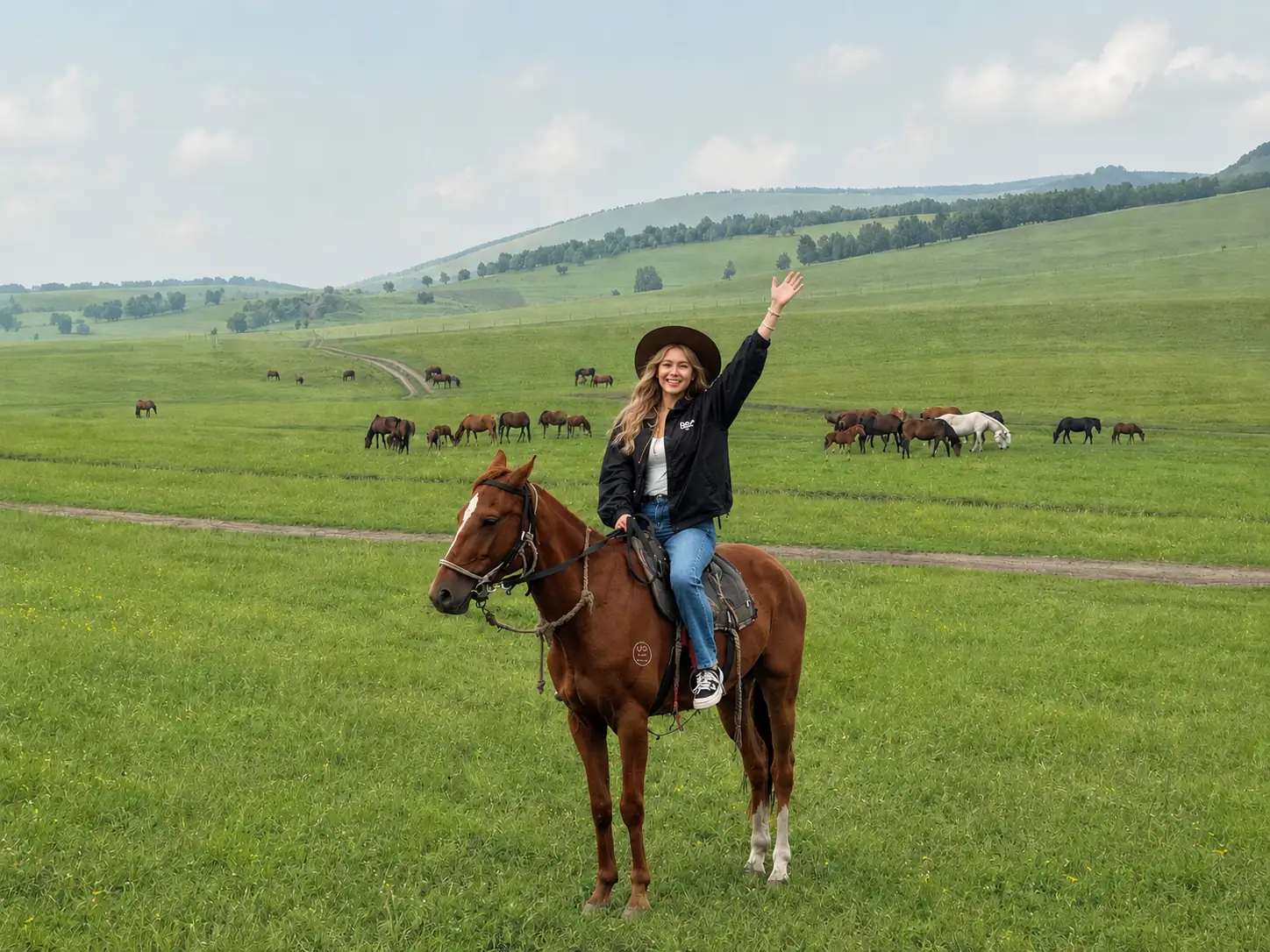 Traveler horseback riding across a green grassland in Inner Mongolia