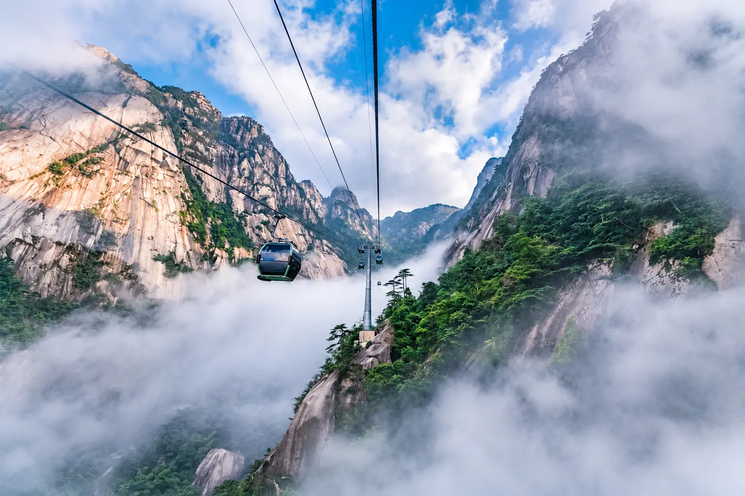 Mount Huangshan granite peaks, pine trees and mountain route scenery