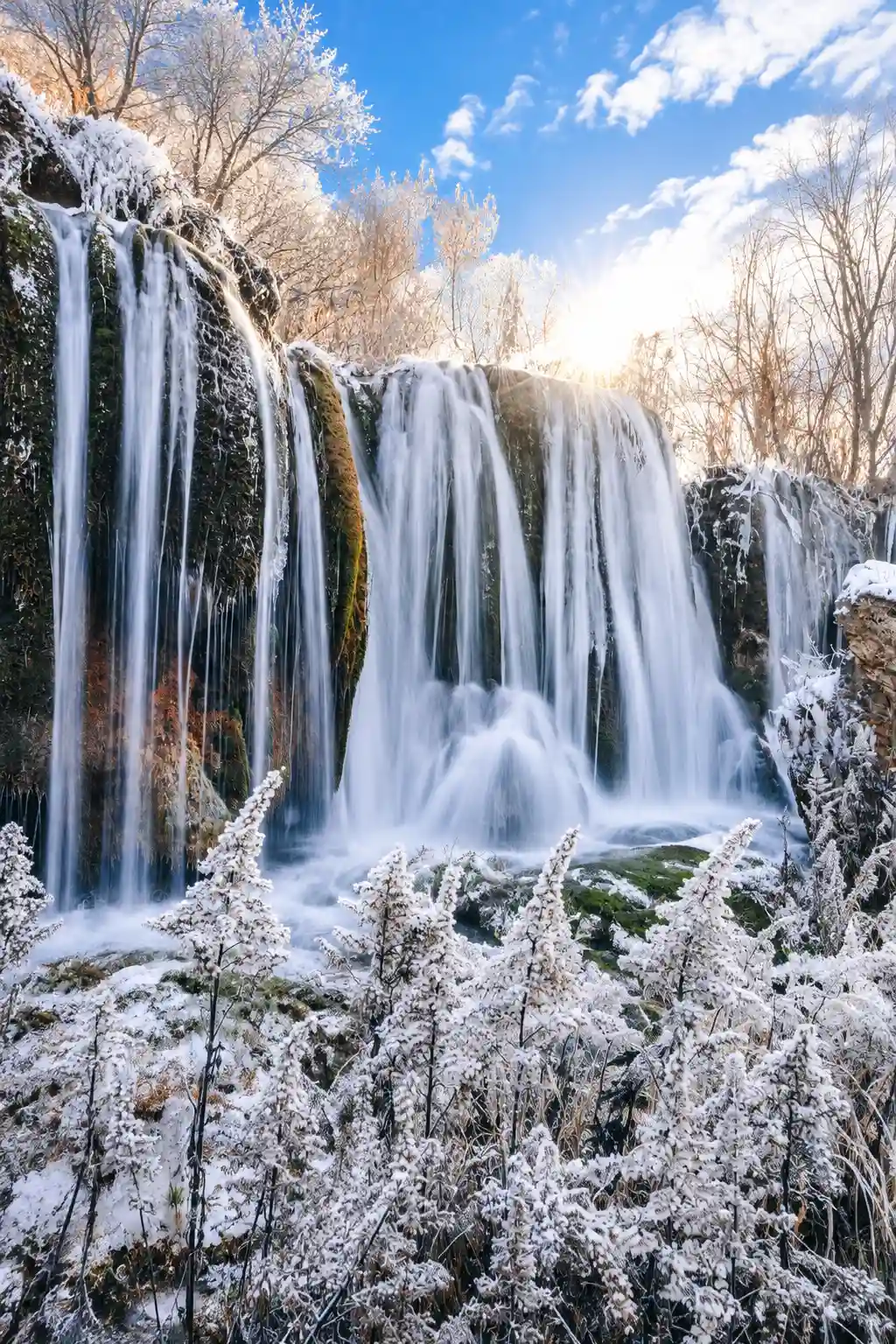 Snow and frozen waterfall scenery in Jiuzhaigou during winter