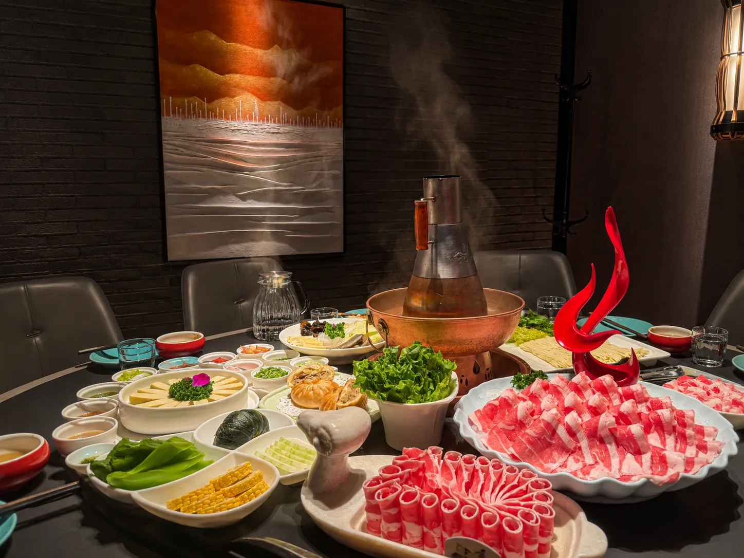 Inner Mongolian hotpot meal with sliced lamb and shared dishes