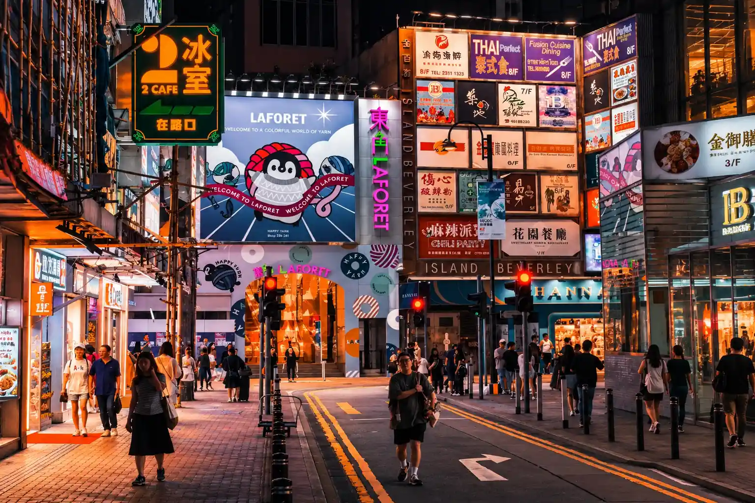 Neon-lit shopping street in Hong Kong at night