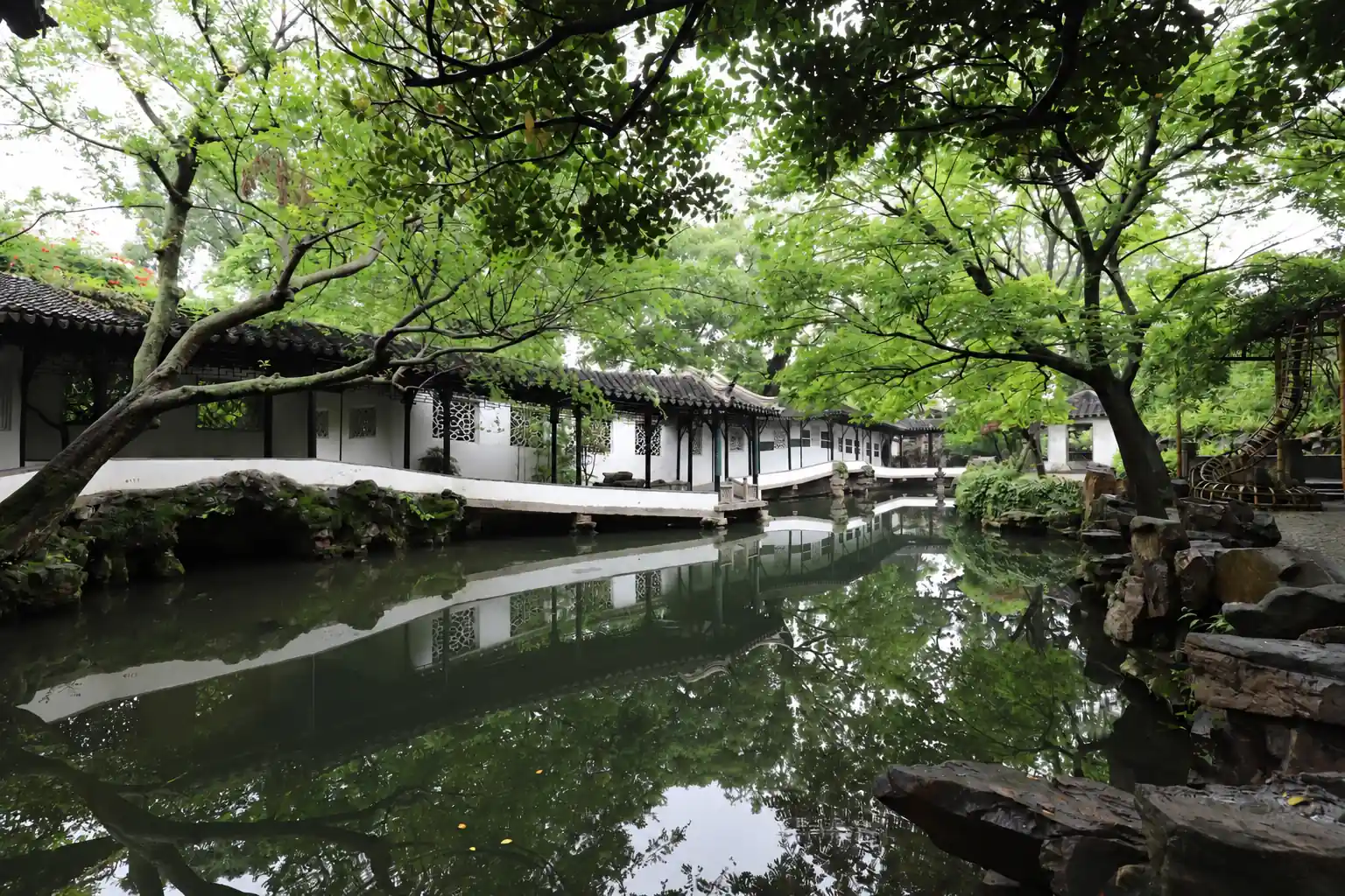 The Humble Administrator‘s Garden in Suzhou, featuring ponds and covered walkways