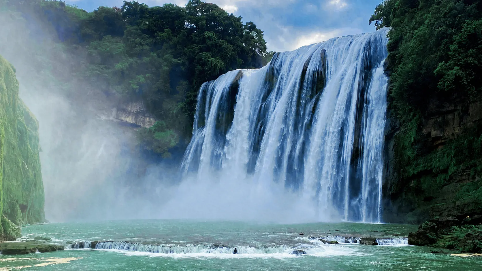 Mist-shrouded Huangguoshu Waterfall in Guizhou, China
