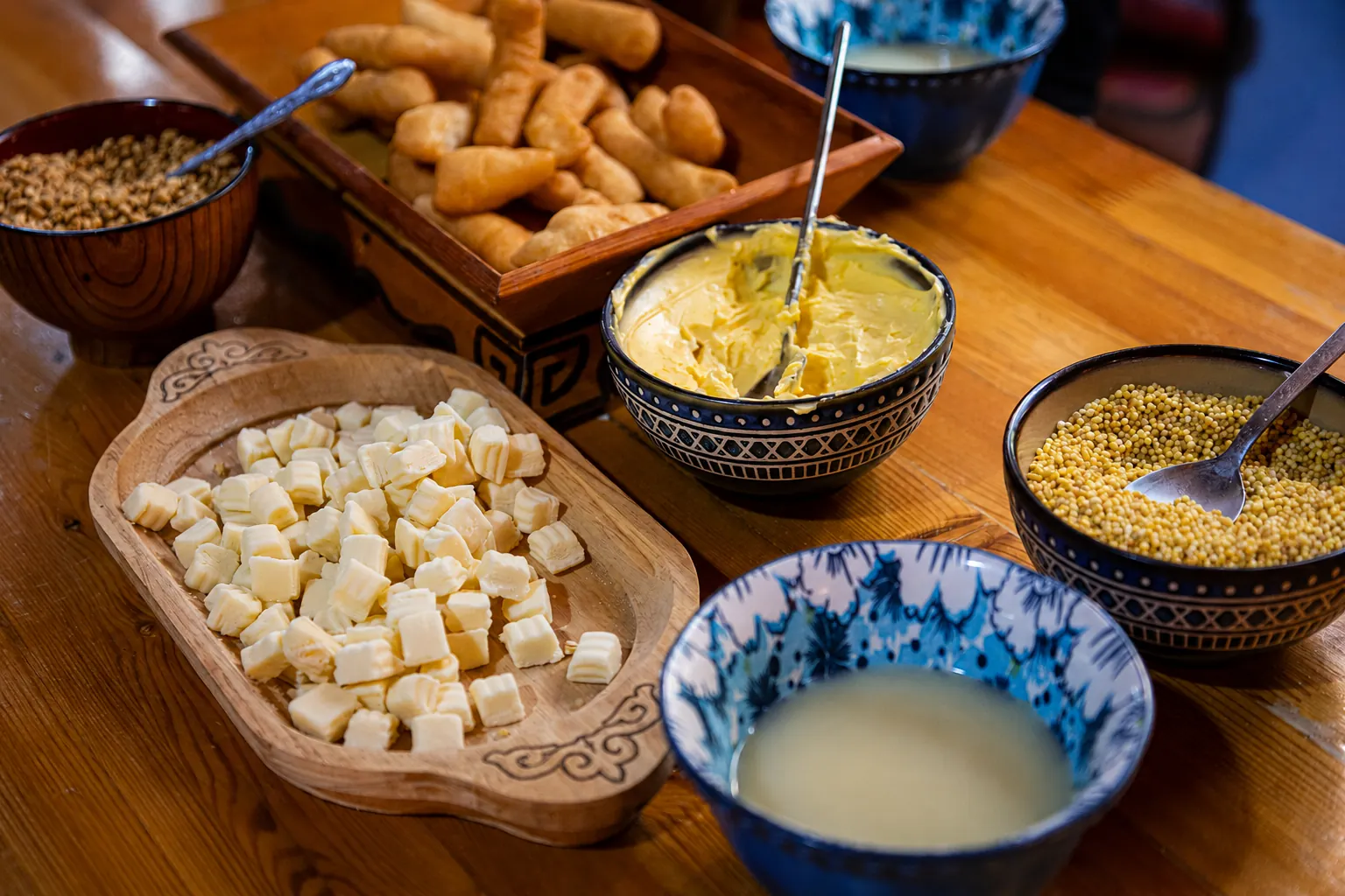 Traditional Mongolian breakfast with dairy products and roasted grain